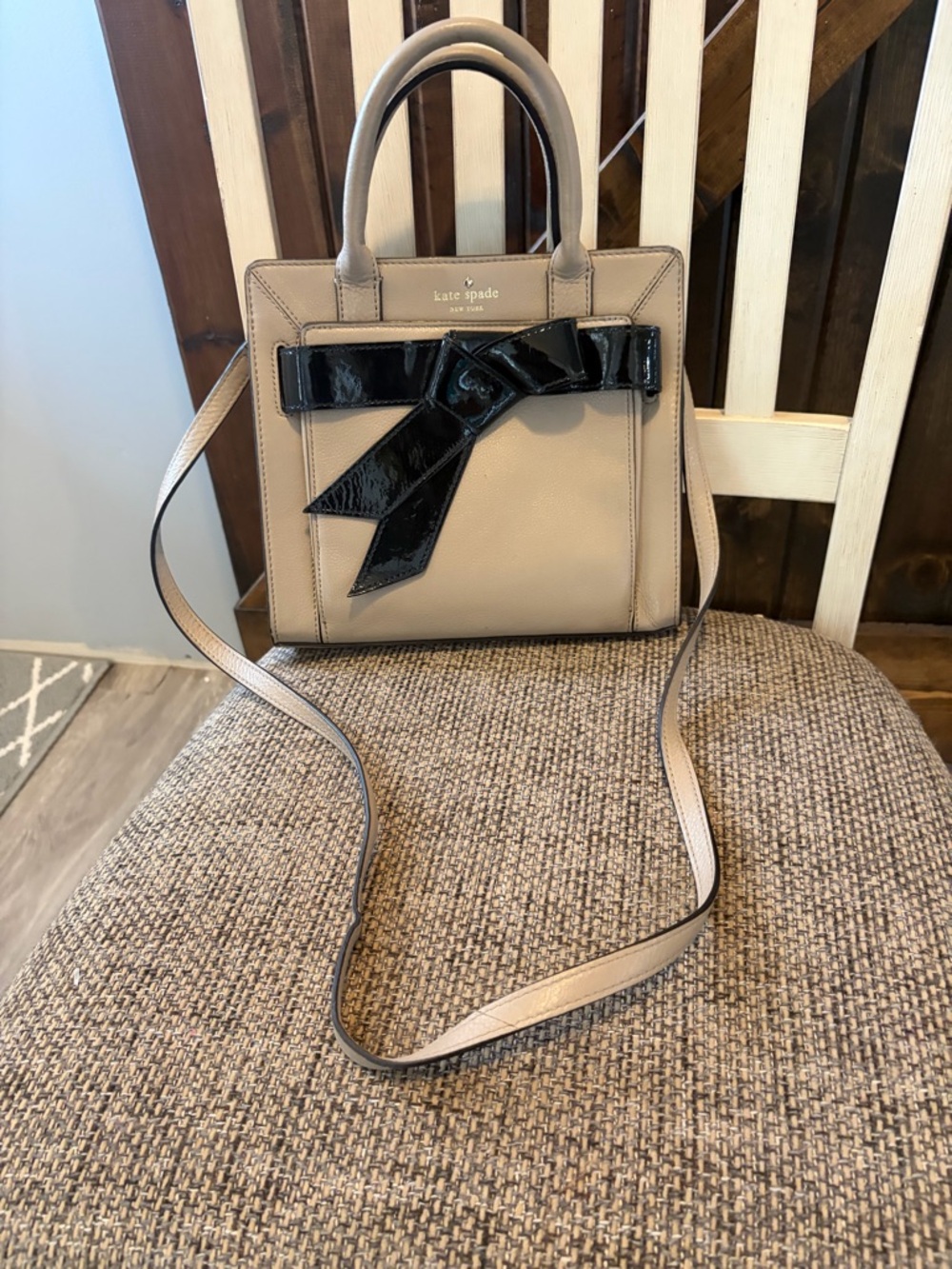 kate spade taupe satchel with glossy black bow